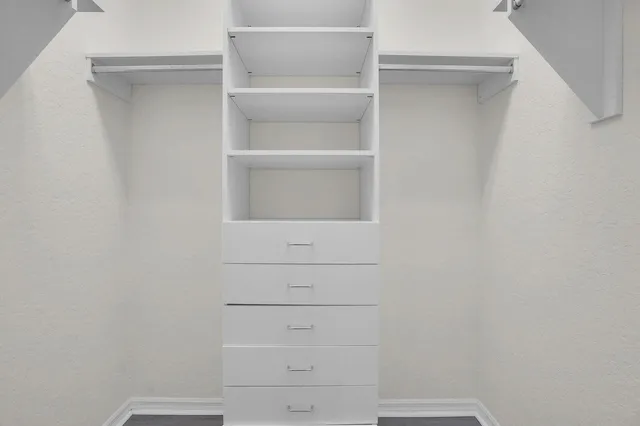 a view of a room with a table and chairs