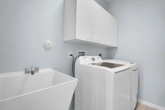 a view of a dining room with furniture and a window