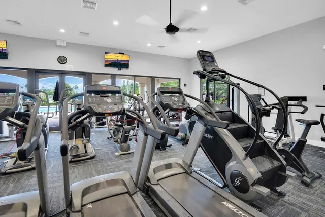 a living room with furniture a rug and a flat screen tv