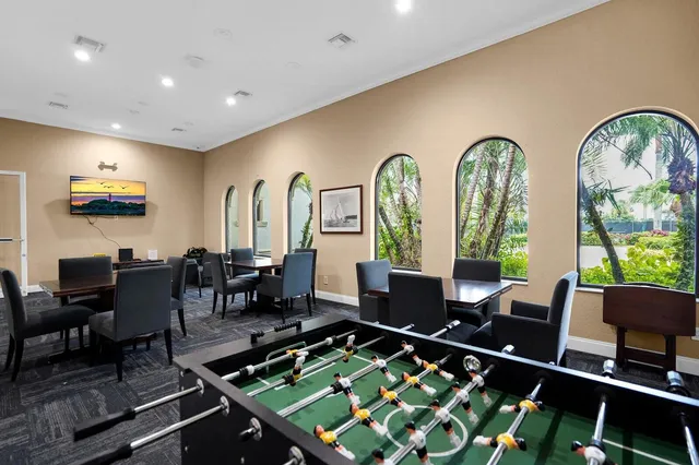 a kitchen with granite countertop a refrigerator and a sink