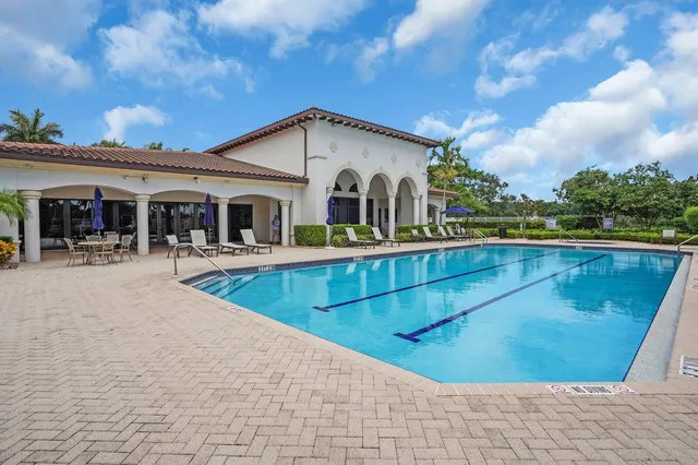 a view of a swimming pool with a patio