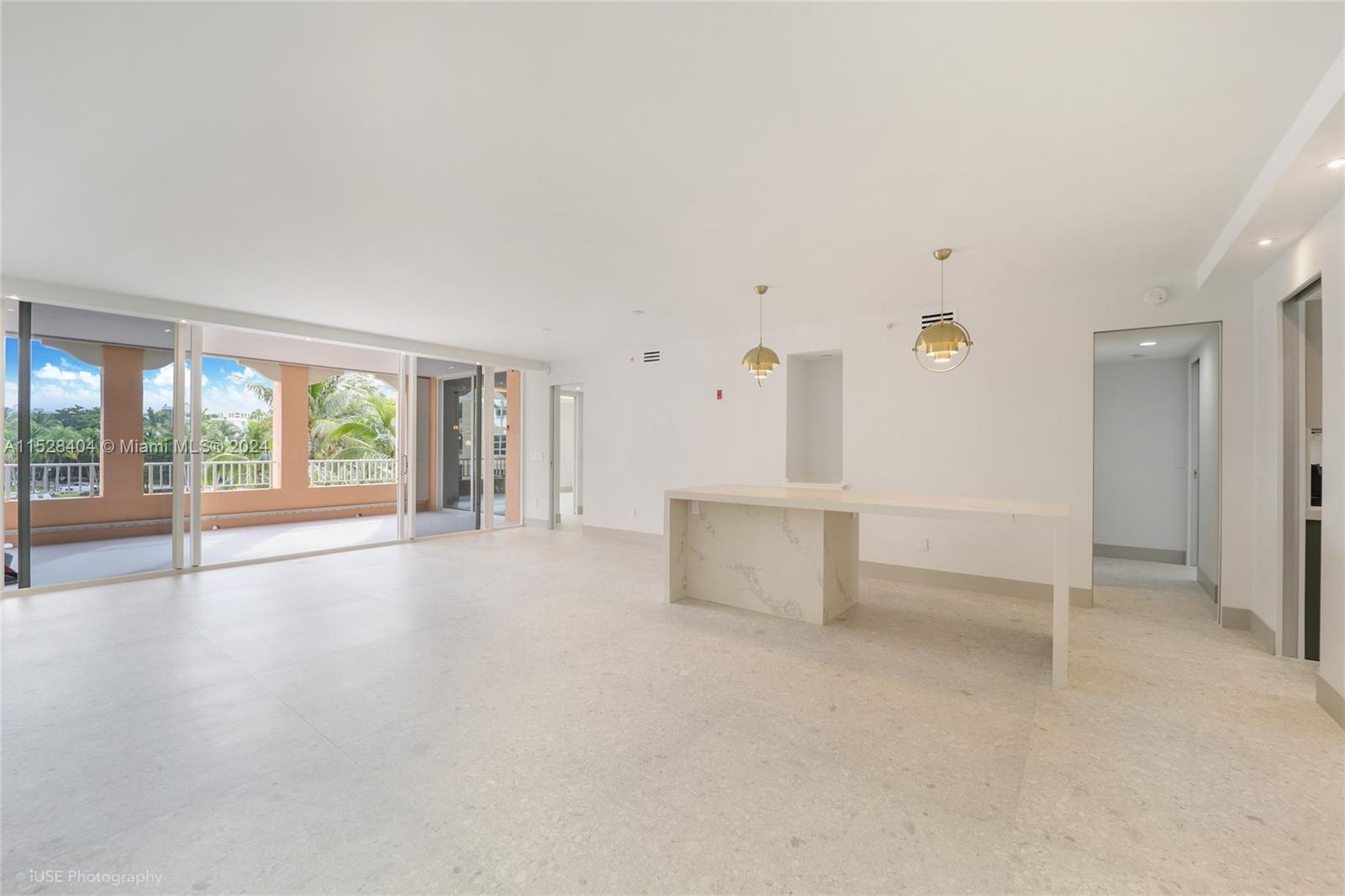 Lake Villa Key Biscayne, FL 33149 - Photo 13 of 51 an empty room with entrance and windows