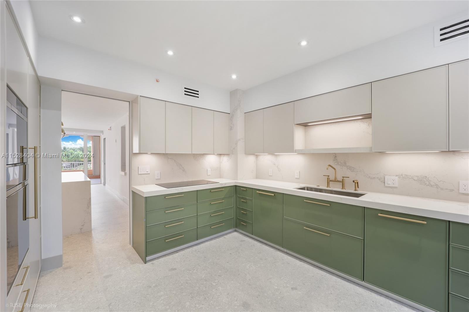 Lake Villa Key Biscayne, FL 33149 - Photo 2 of 51 a kitchen with sink and cabinets