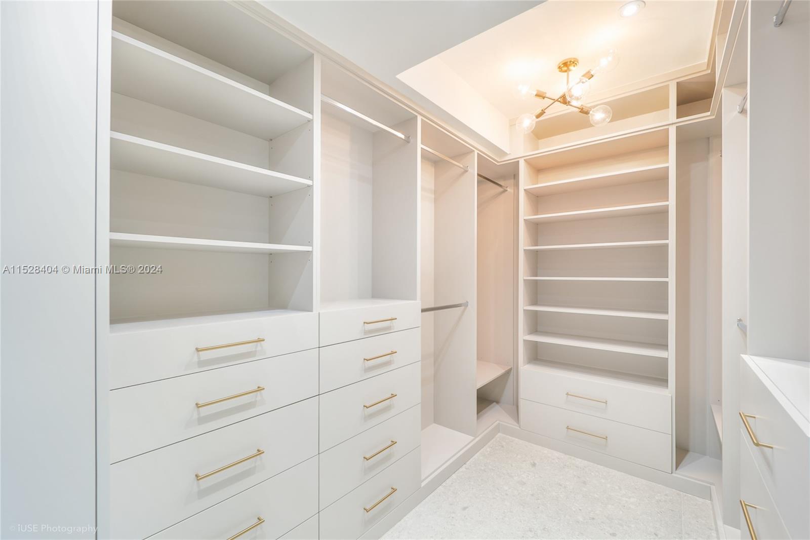 Lake Villa Key Biscayne, FL 33149 - Photo 23 of 51 a view of walk in closet