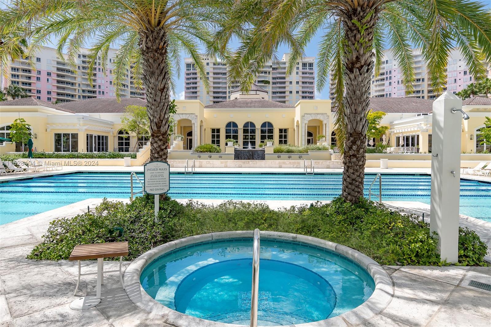 Lake Villa Key Biscayne, FL 33149 - Photo 39 of 51 a view of a house with a swimming pool and a patio