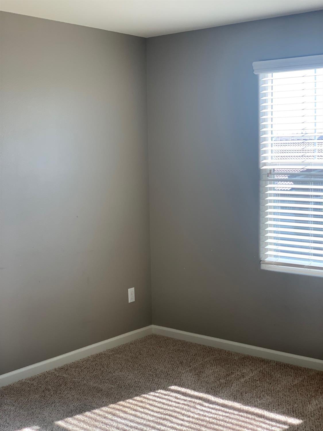 2205 Lombard Lane Clovis, CA 93619 - Photo 12 of 13 an empty room with a window