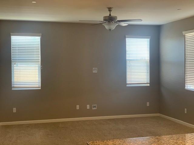 2205 Lombard Lane Clovis, CA 93619 - Photo 3 of 13 a view of an empty room with a window