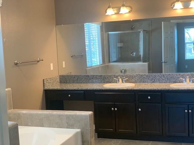 2205 Lombard Lane Clovis, CA 93619 - Photo 7 of 13 a bathroom with a sink and a mirror