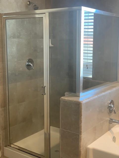 2205 Lombard Lane Clovis, CA 93619 - Photo 9 of 13 a bathroom with a shower and a sink