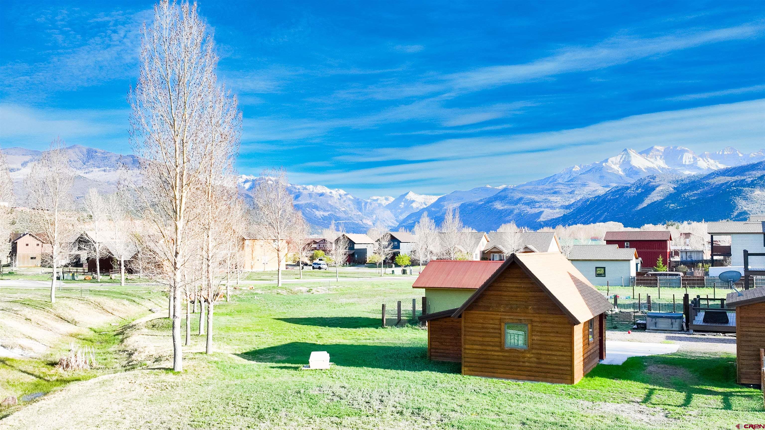 470-480 Kismet Street Ridgway, CO 81432 - Photo 6 of 20 a view of backyard of house and car parked