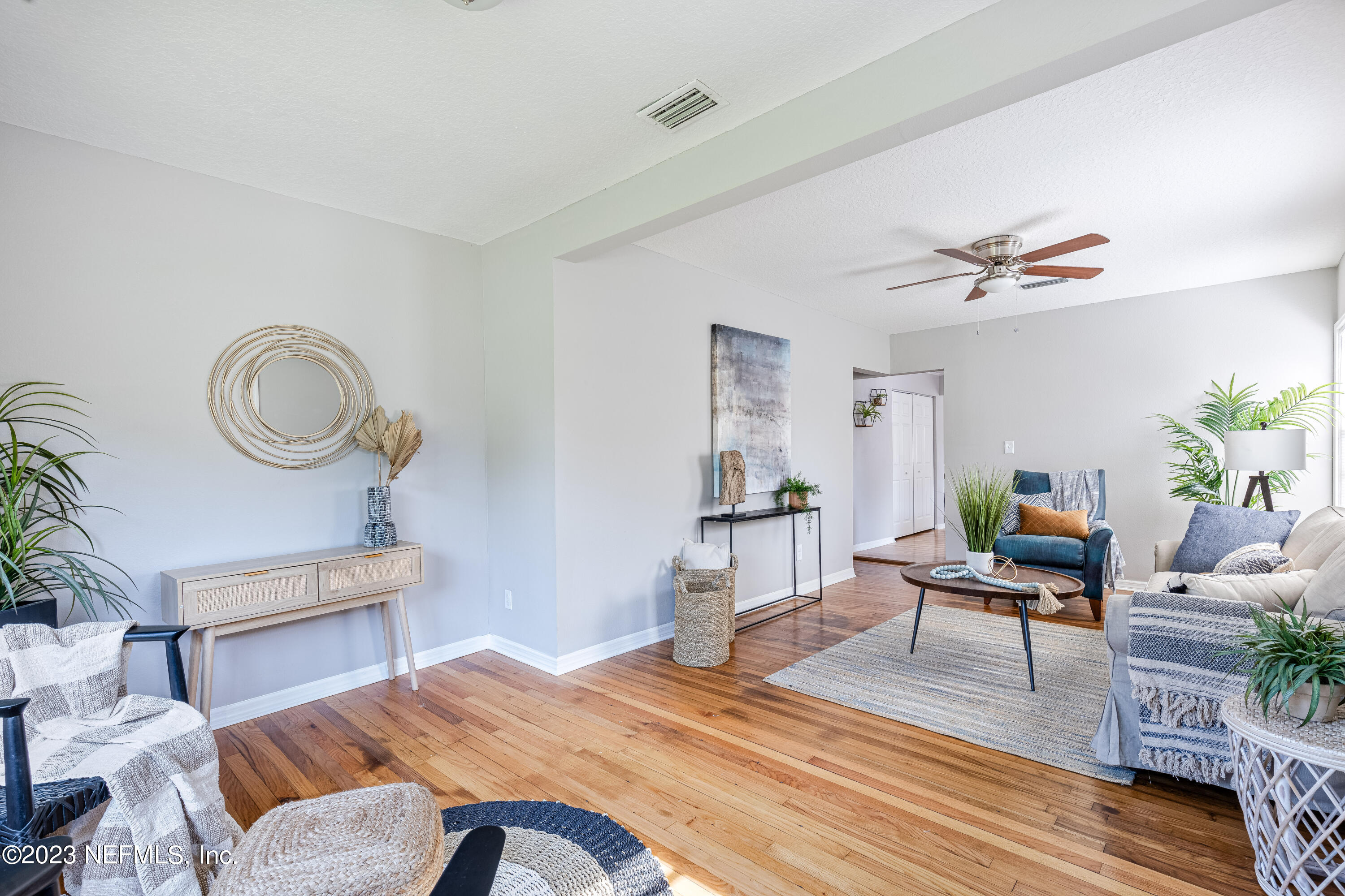 4729 Cambridge Road Jacksonville, FL 32210 - Photo 11 of 37 a living room with furniture and a wooden floor