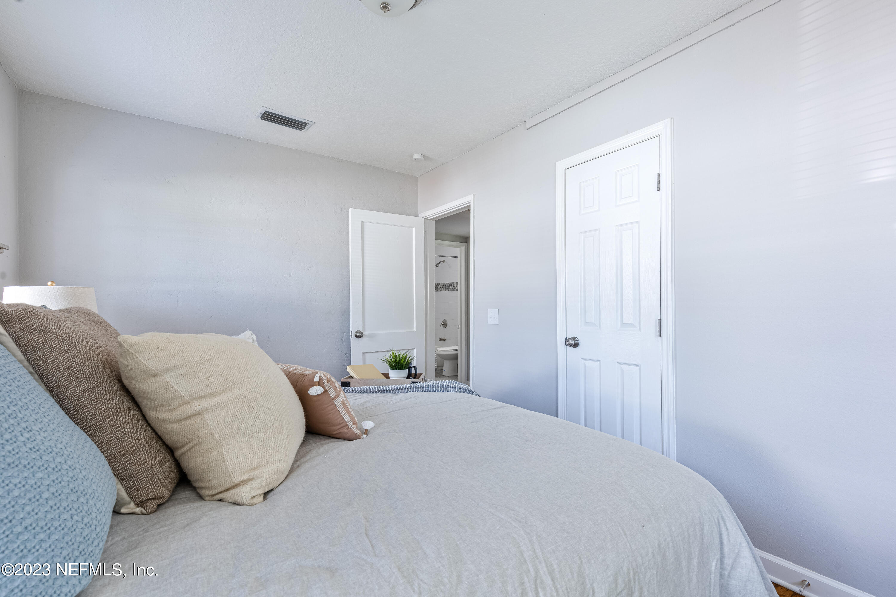 4729 Cambridge Road Jacksonville, FL 32210 - Photo 24 of 37 a bedroom with a bed and a window