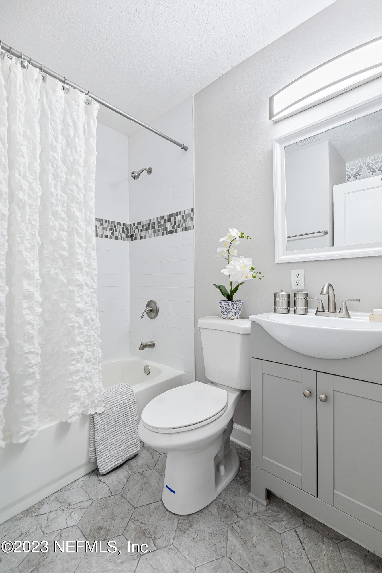 4729 Cambridge Road Jacksonville, FL 32210 - Photo 26 of 37 a bathroom with a toilet sink and mirror