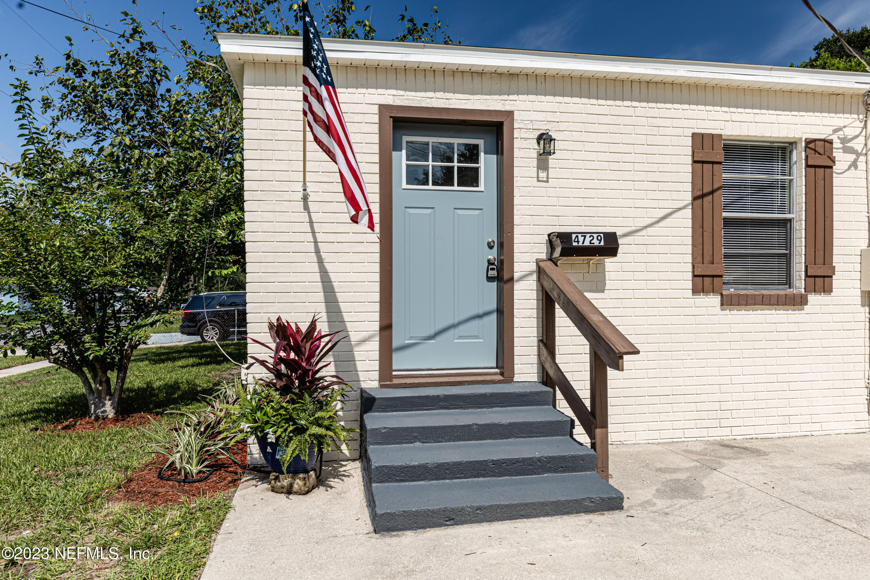 4729 Cambridge Road Jacksonville, FL 32210 - Photo 5 of 37 a view of a house with entryway and flower plants