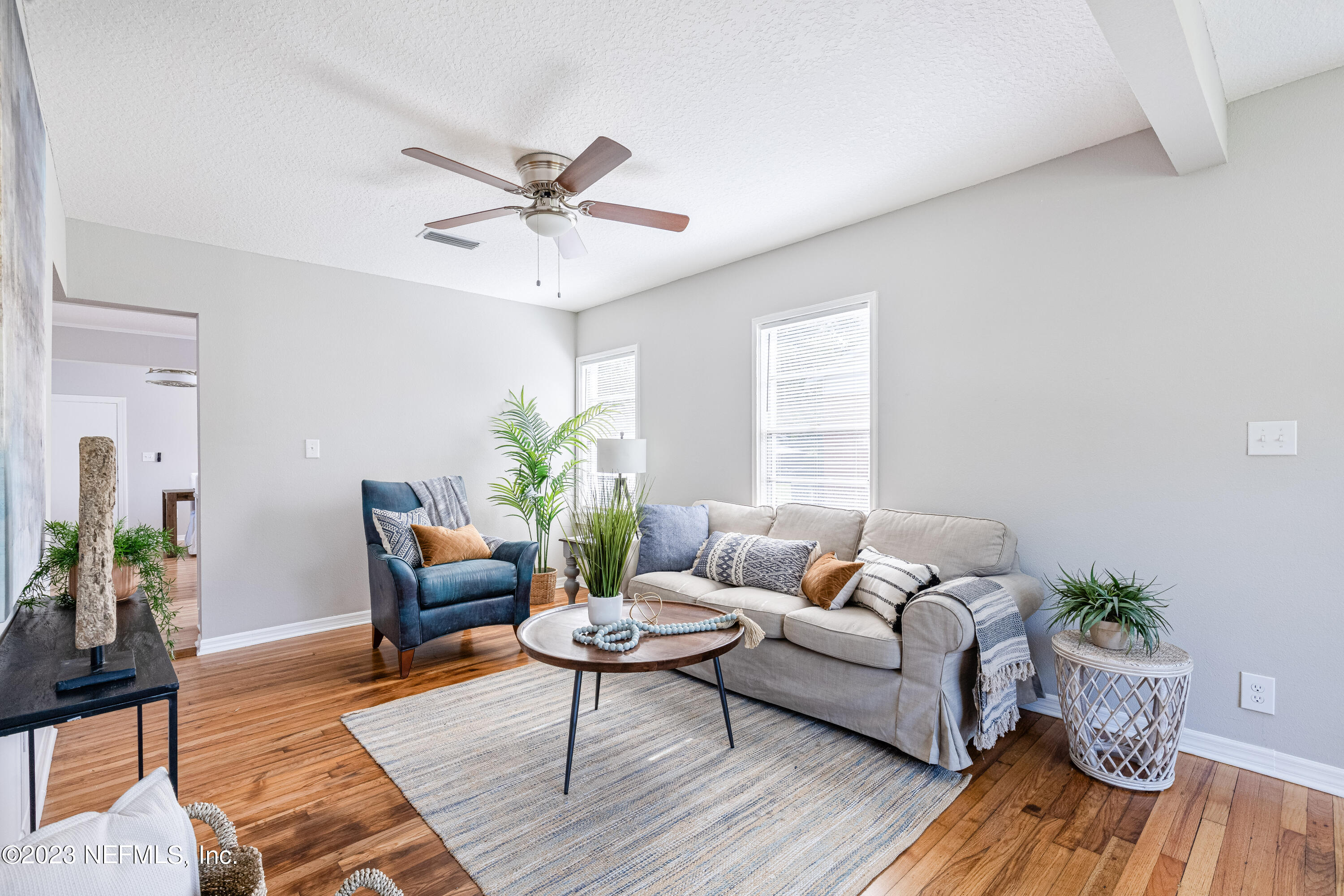 4729 Cambridge Road Jacksonville, FL 32210 - Photo 10 of 37 a living room with furniture and wooden floor