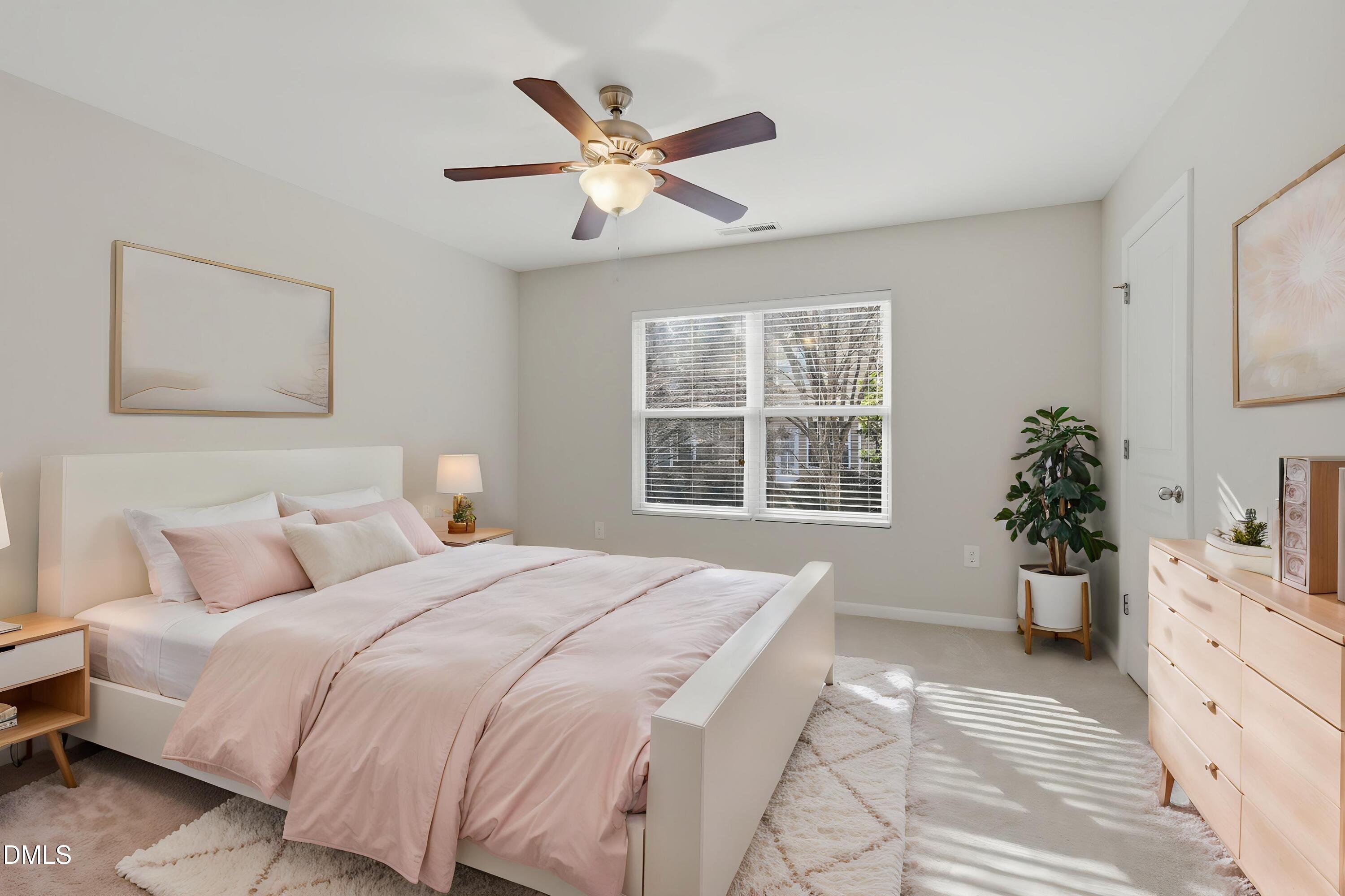 2907 Berkeley Springs Place Raleigh, NC 27616 - Photo 14 of 32 a bedroom with a large bed and a window