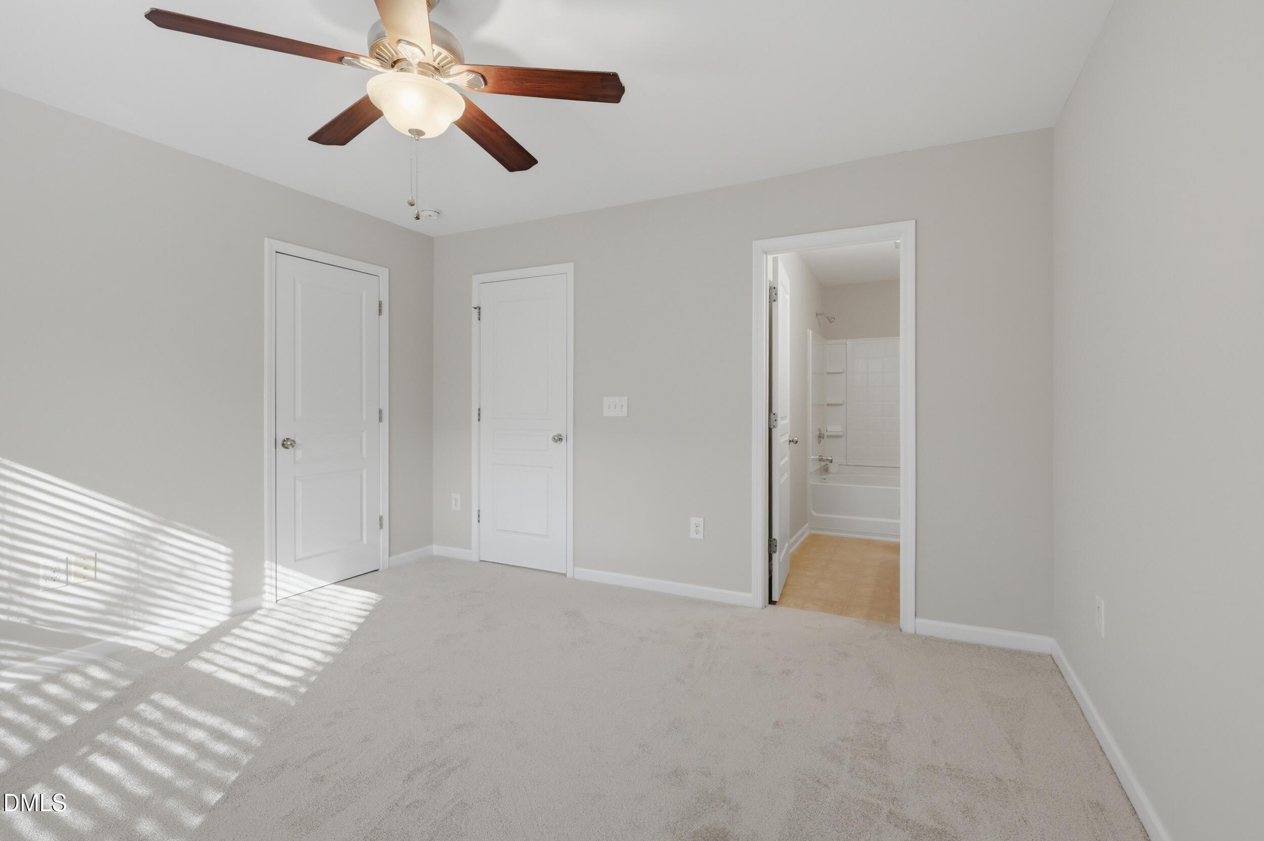 2907 Berkeley Springs Place Raleigh, NC 27616 - Photo 21 of 32 a view of an empty room and chandelier fan