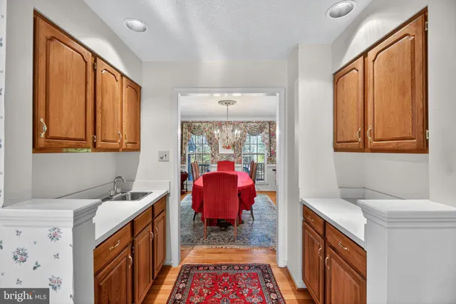 a hallway with a sink and a window