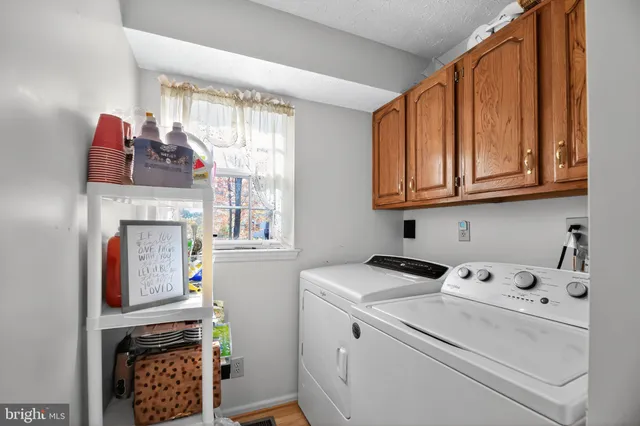 a view of washer and dryer with kitchen countertops