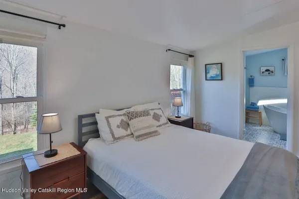 a bedroom with a bed and a table