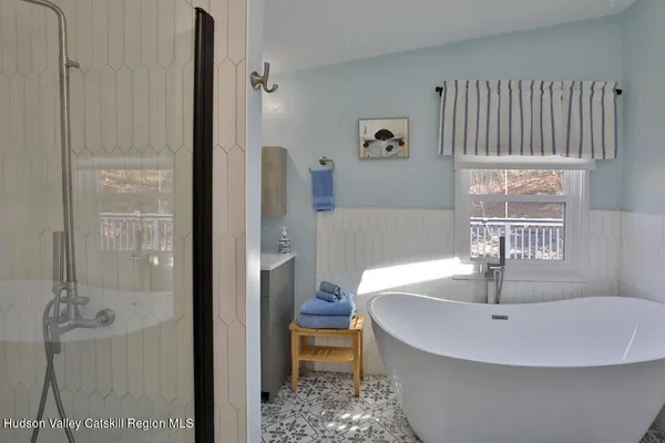 a bathroom with a sink and a window