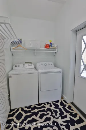 a room with a stove and a cabinet