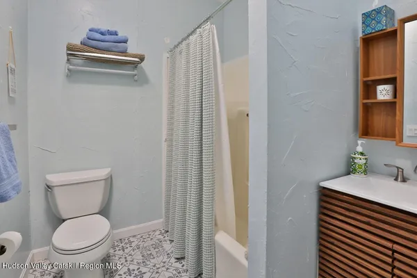 a bathroom with a toilet and a sink