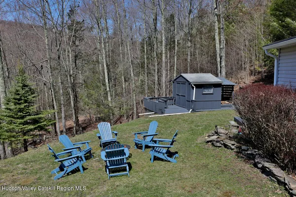 a backyard of a house with outdoor seating