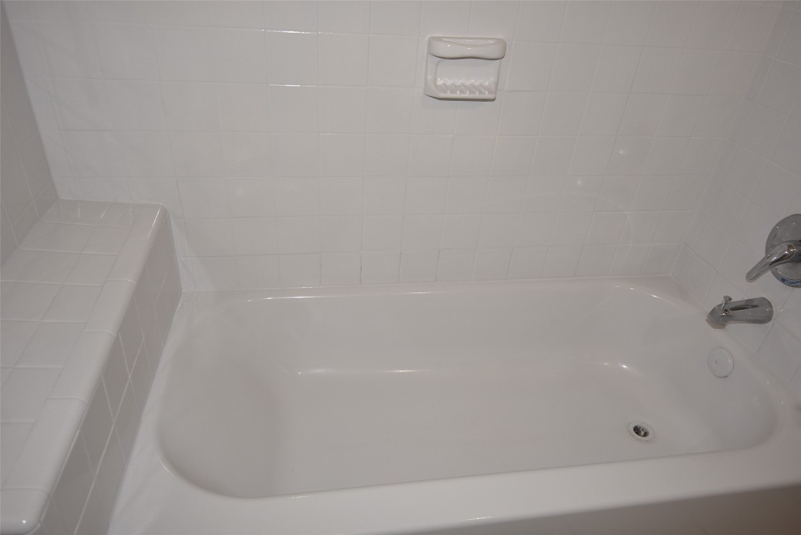 4618 Clay Street Houston, TX 77023 - Photo 17 of 20 a close up of a bathtub