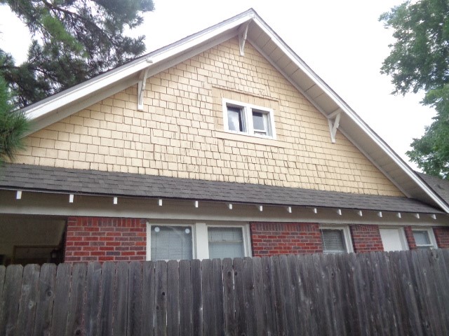 4618 Clay Street Houston, TX 77023 - Photo 3 of 20 a view of a house with a wooden fence