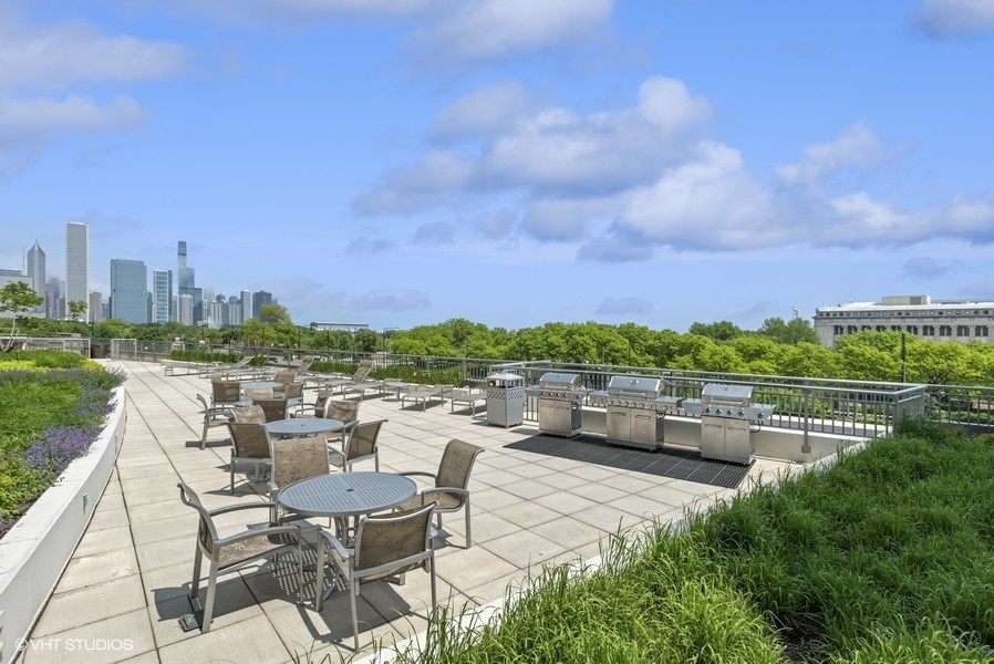 1235 South Prairie Avenue, Unit 2506 Chicago, IL 60605 - Photo 22 of 32 a view of a terrace with furniture