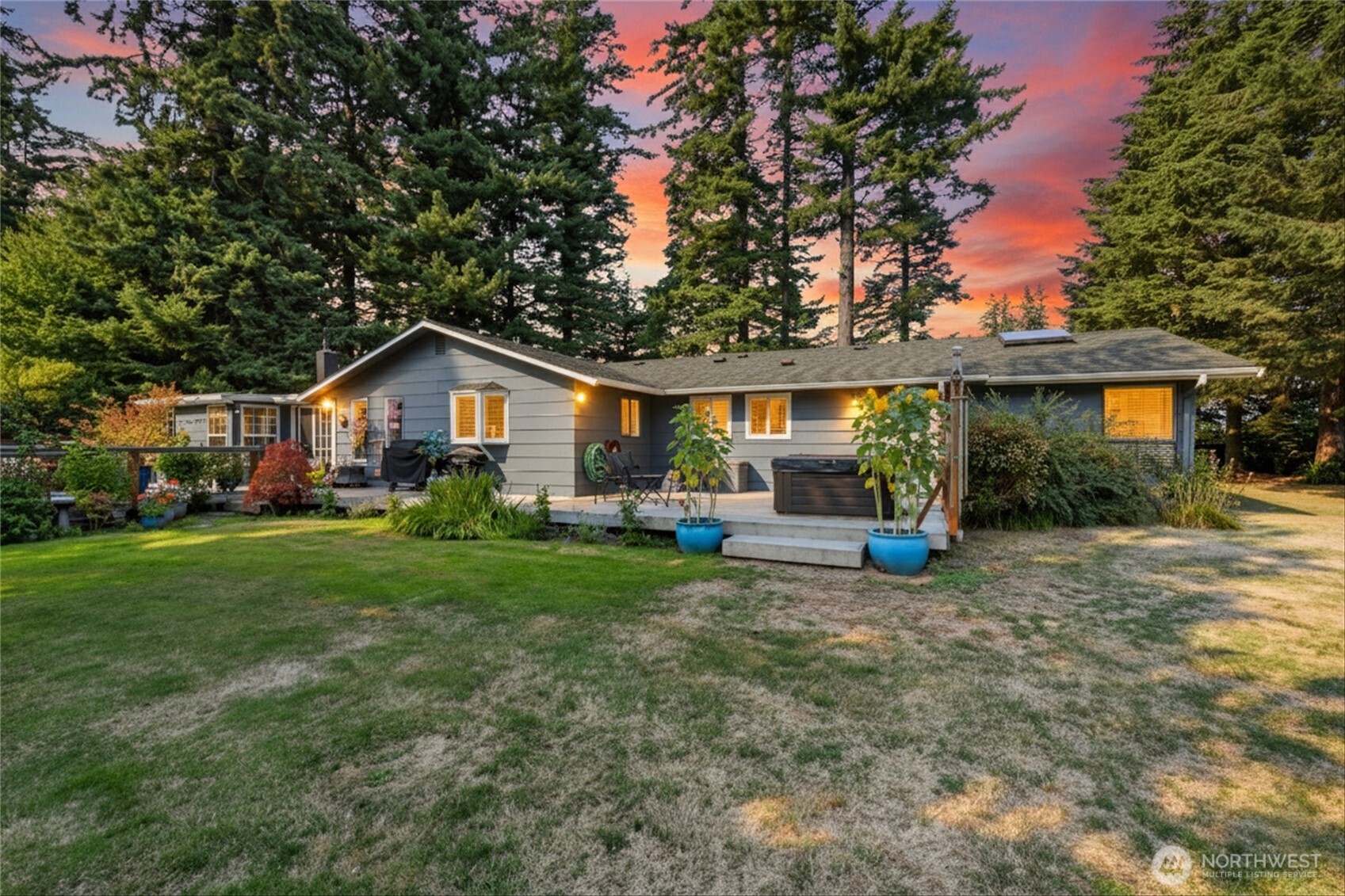 a view of a house with backyard porch and sitting area