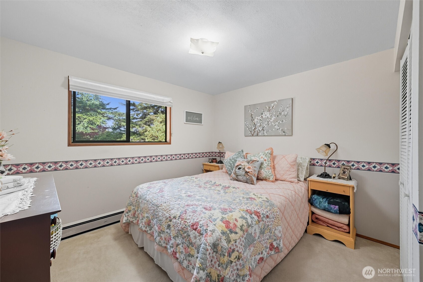 1125 Lattimore Road Ferndale, WA 98248 - Photo 20 of 39 a bedroom with a bed a painting on the wall and a window