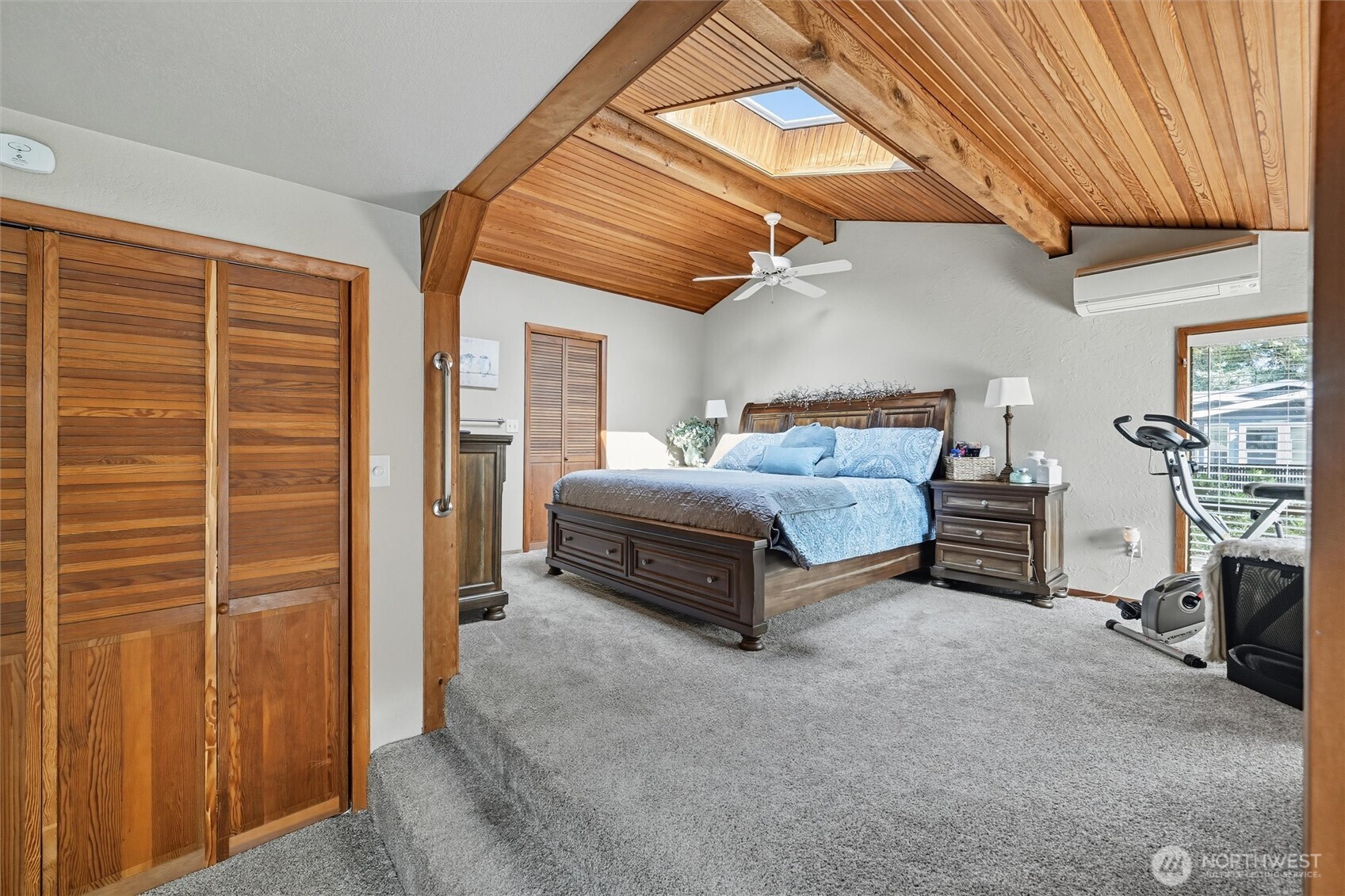 1125 Lattimore Road Ferndale, WA 98248 - Photo 22 of 39 a spacious bedroom with a bed and a chandelier
