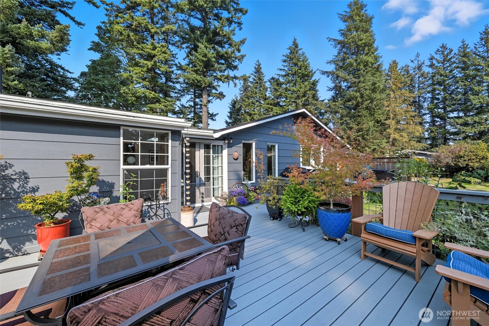 1125 Lattimore Road Ferndale, WA 98248 - Photo 27 of 39 a view of a house with chairs and table in a patio