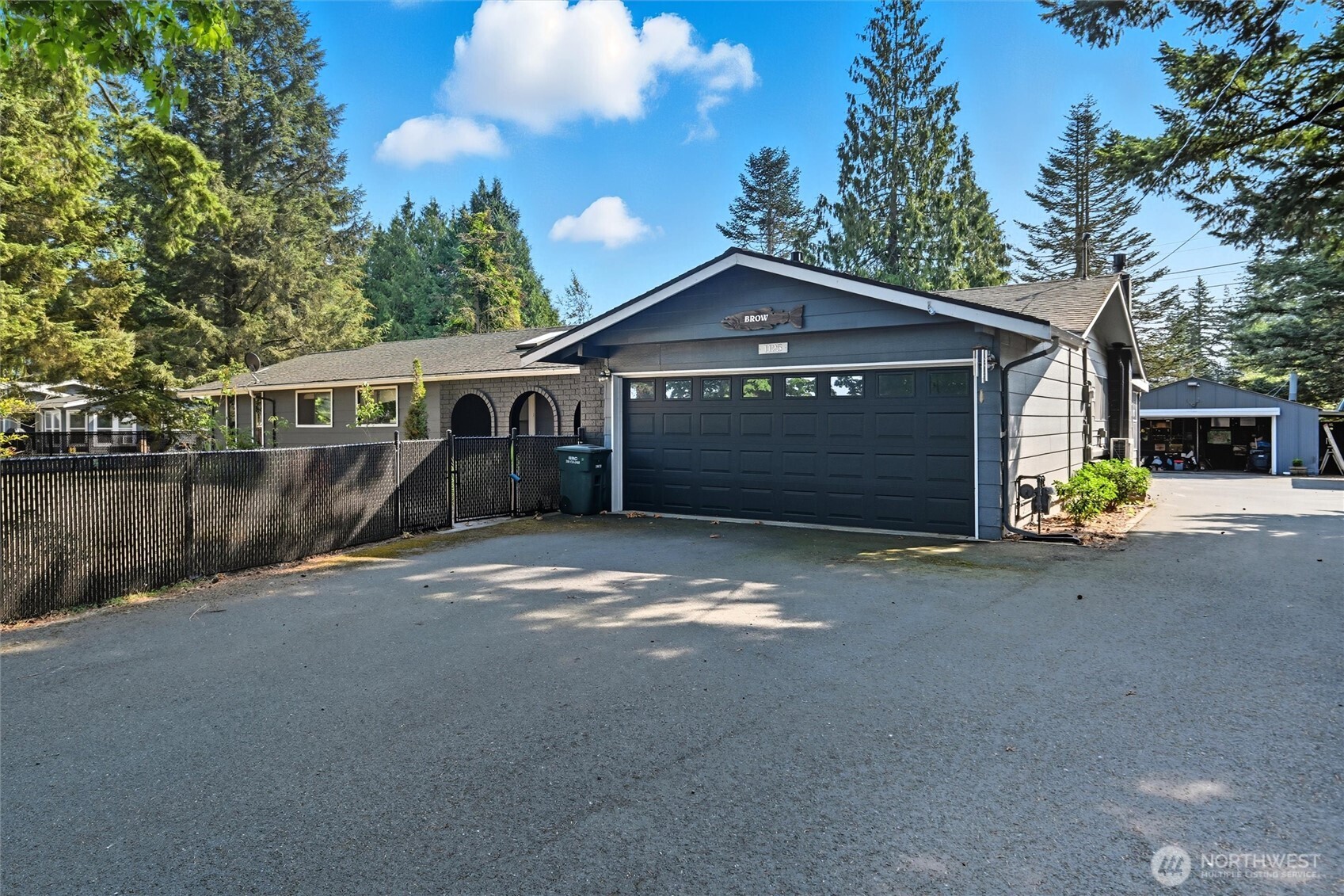 1125 Lattimore Road Ferndale, WA 98248 - Photo 29 of 39 a front view of a house with a yard and garage