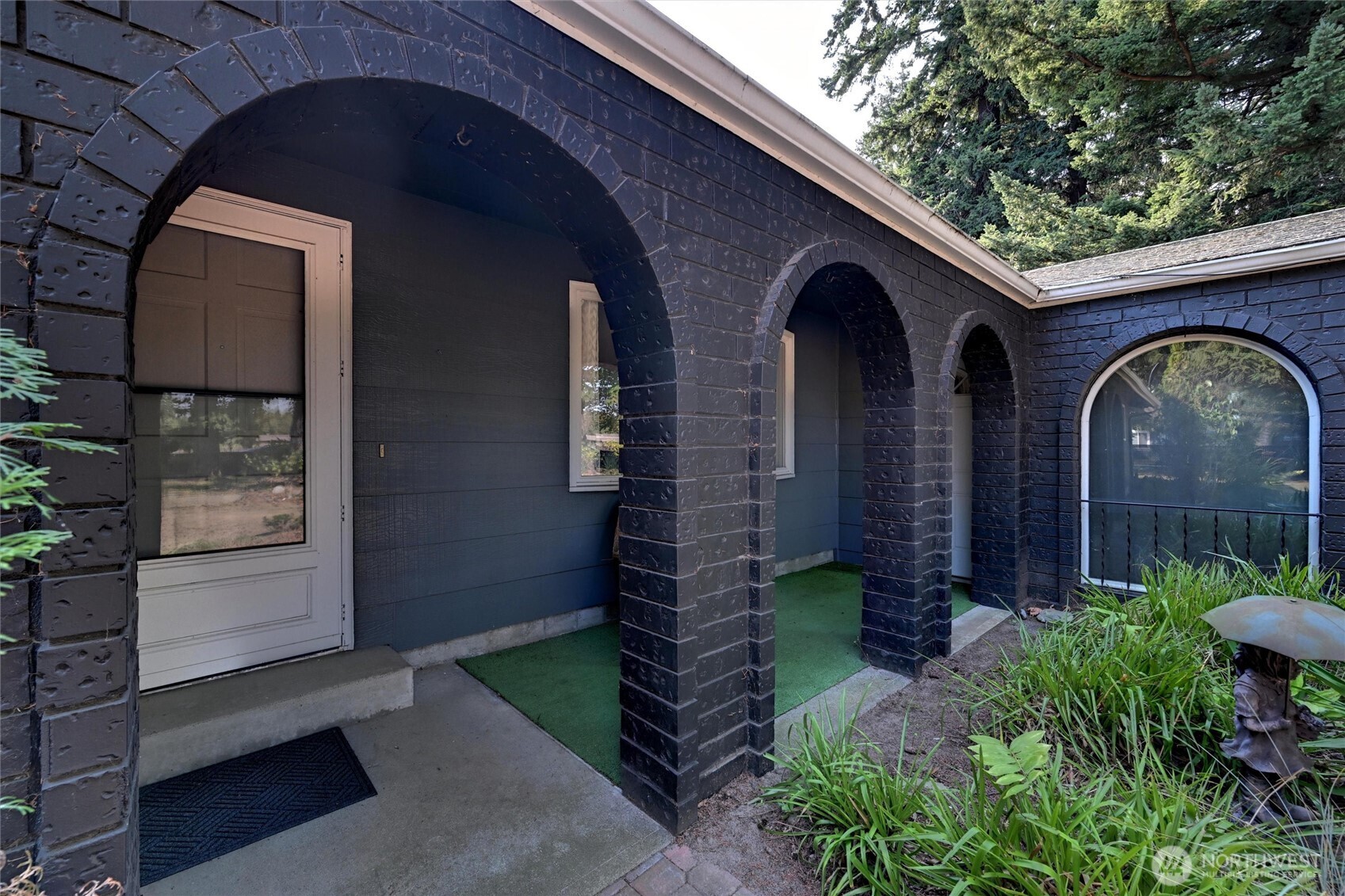 1125 Lattimore Road Ferndale, WA 98248 - Photo 3 of 39 a couple of potted plants in front of a door