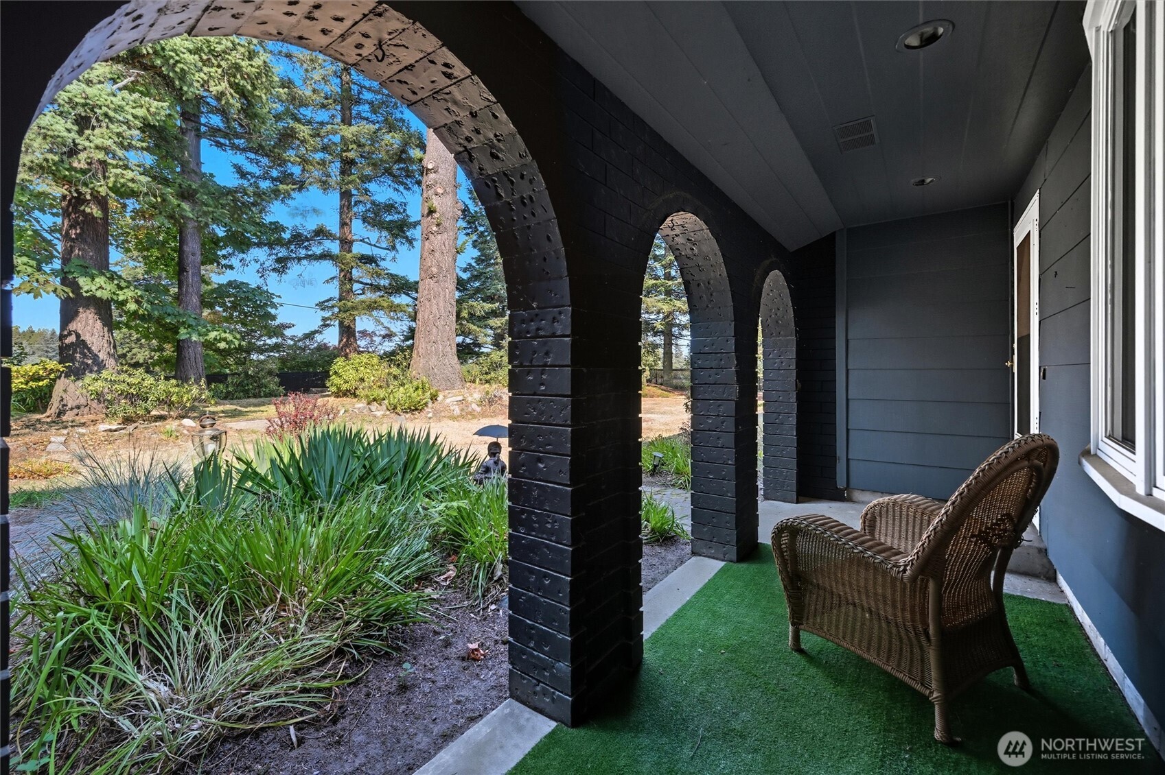 1125 Lattimore Road Ferndale, WA 98248 - Photo 4 of 39 a front view of a house with garden