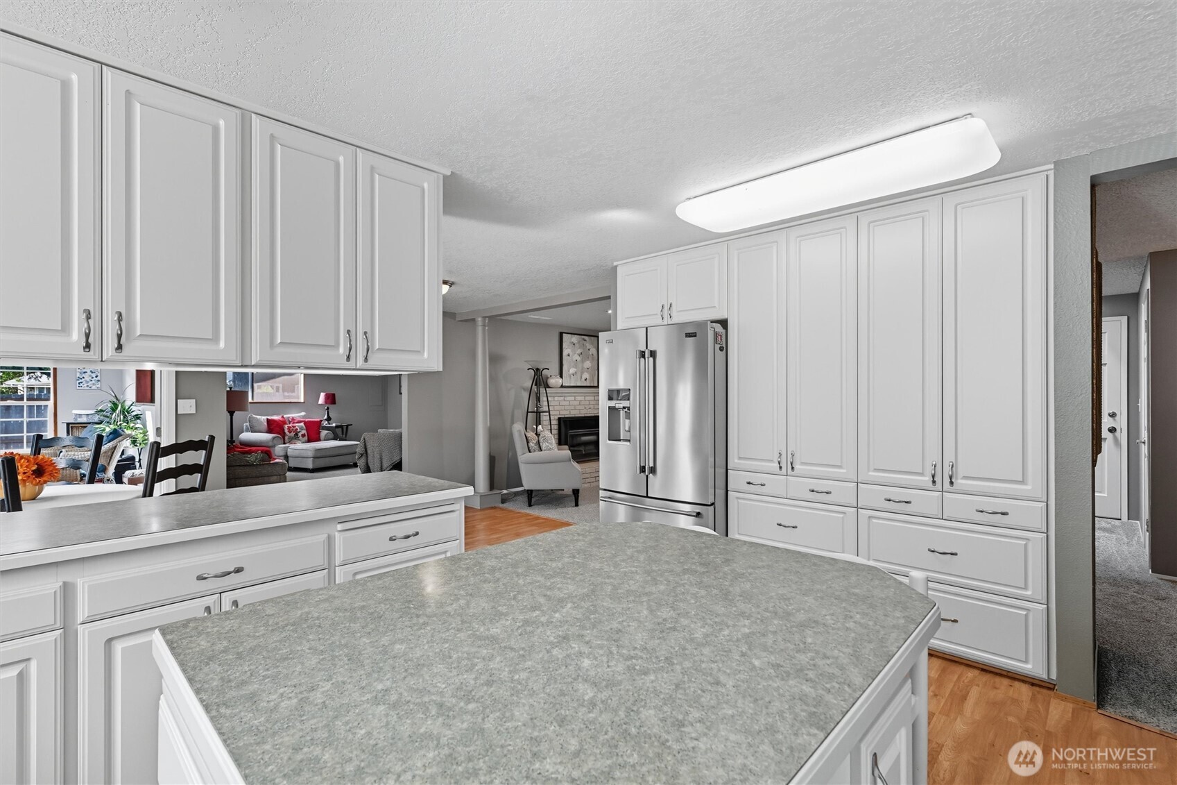 1125 Lattimore Road Ferndale, WA 98248 - Photo 9 of 39 a kitchen with white cabinets and counter space