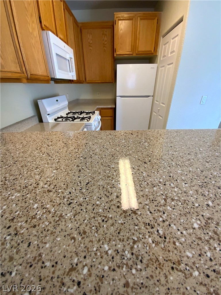 4730 East Craig Road, Unit 1091 Las Vegas, NV 89115 - Photo 8 of 14 Functional kitchen with ample cabinet space and modern appliances for daily culinary needs.