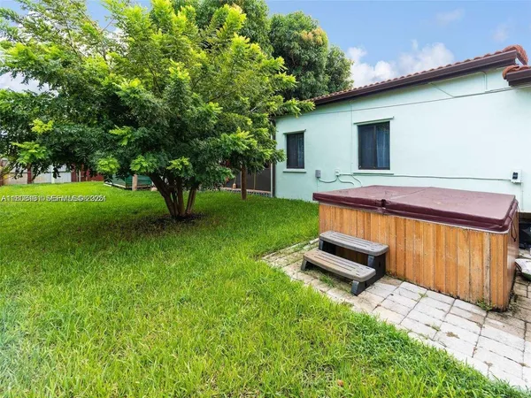 a view of a backyard with a garden