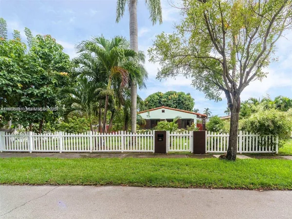a front view of a house having garden