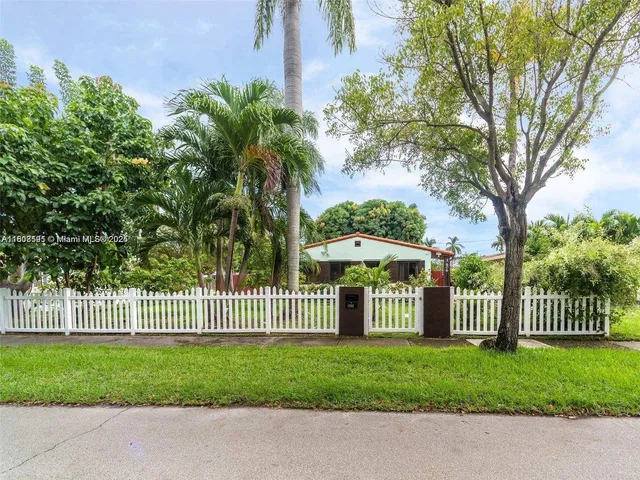 a front view of a house having garden