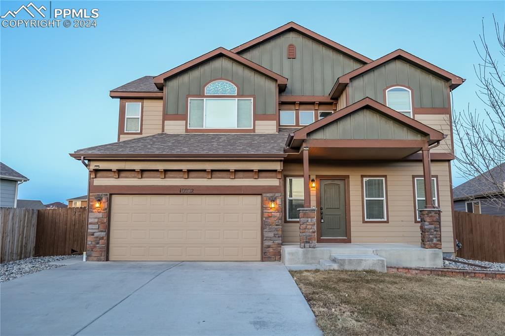 a front view of a house with yard