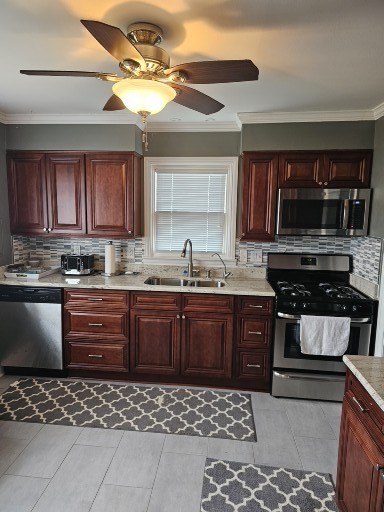 28227 West Fox River Road Cary, IL 60013 - Photo 6 of 13 a kitchen with a sink a stove and cabinets