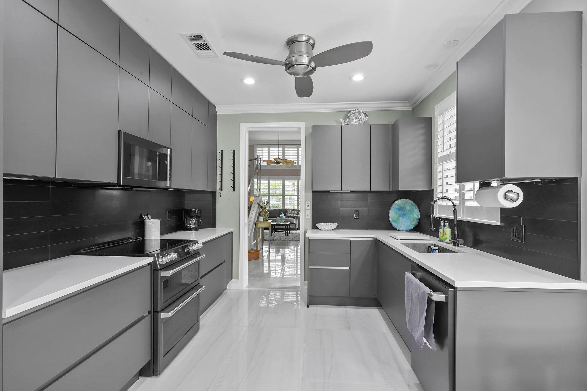 a kitchen with a sink stainless steel appliances and cabinets