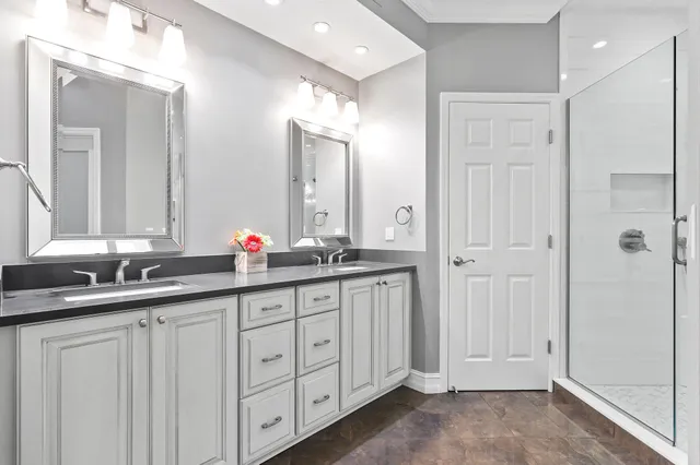 a view of a hallway with a livingroom and a bathroom