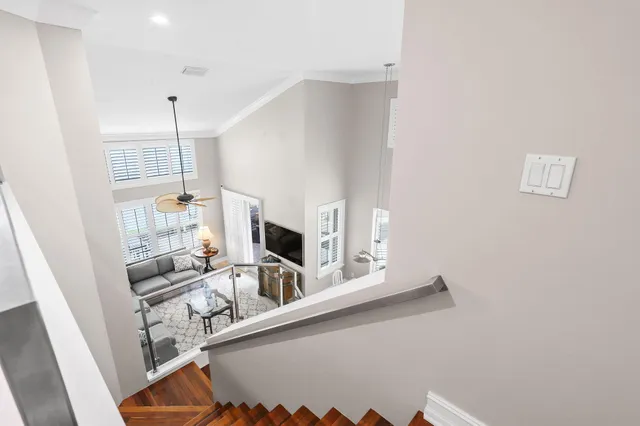 a bathroom with a granite countertop sink toilet a mirror and shower