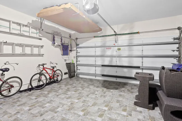 a view of a patio with couches table and chairs and potted plants