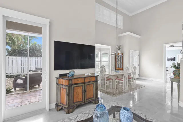 a dining room with furniture and window